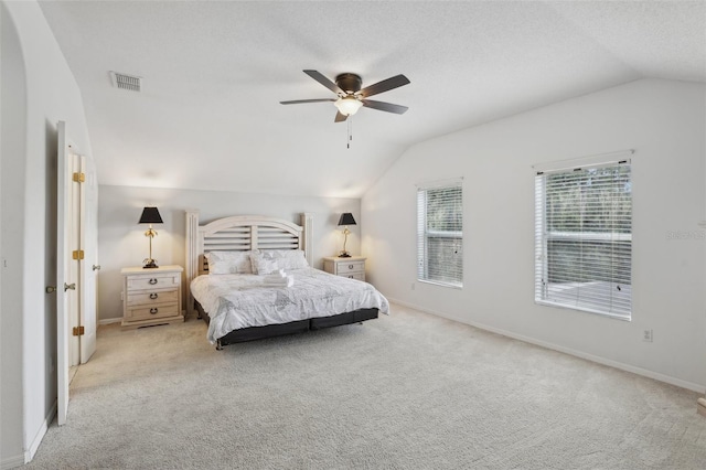 carpeted bedroom featuring lofted ceiling and ceiling fan