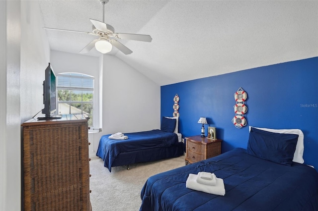 carpeted bedroom featuring lofted ceiling, ceiling fan, and a textured ceiling