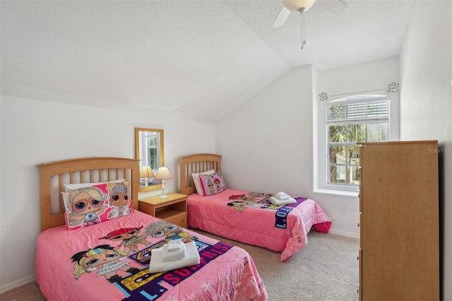 carpeted bedroom with lofted ceiling, ceiling fan, and a textured ceiling