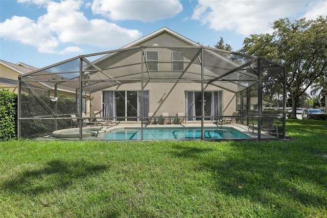 back of property featuring a yard and glass enclosure