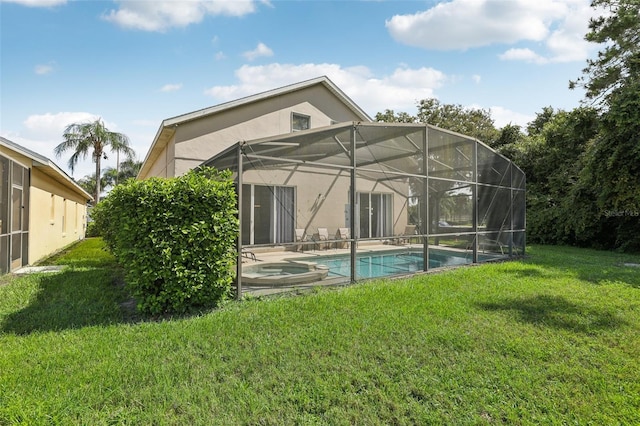 back of property with a lanai and a yard