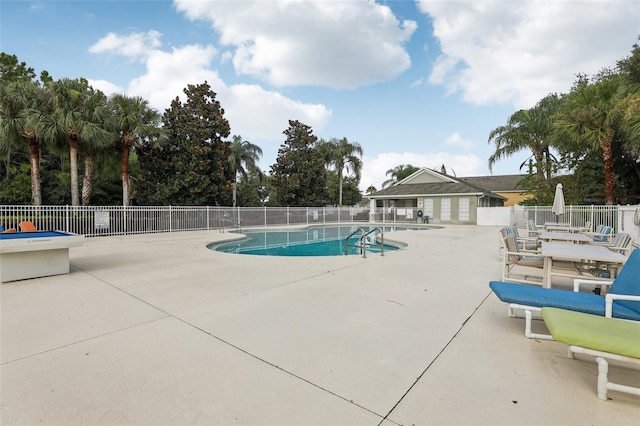 view of swimming pool featuring a patio