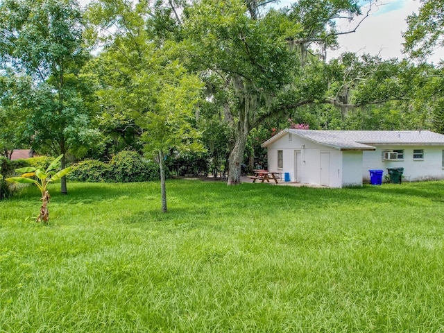 view of yard featuring an AC wall unit