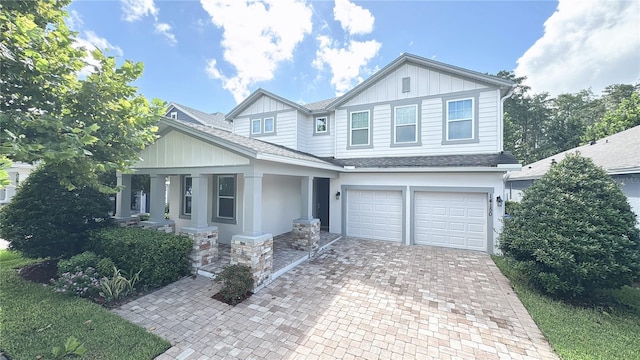 craftsman-style home with a garage and covered porch