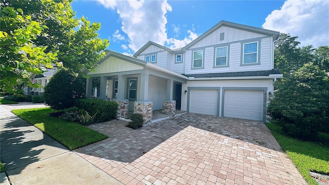 craftsman-style home with a garage and covered porch