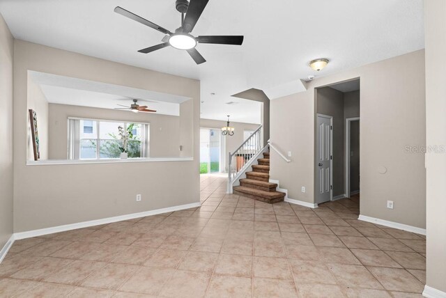 10617 Bamboo Rod Cir, Riverview, FL 33569 - unfurnished room featuring stairs, plenty of natural light, a ceiling fan, and baseboards