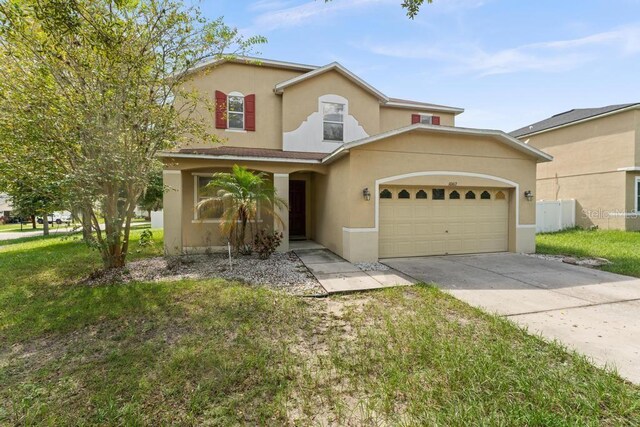 10617 Bamboo Rod Cir, Riverview, FL 33569 - traditional-style house featuring concrete driveway, stucco siding, and an attached garage