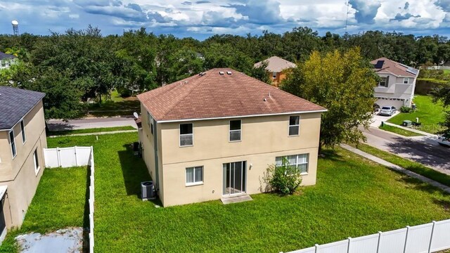 10617 Bamboo Rod Cir, Riverview, FL 33569 - rear view of house featuring central AC unit, stucco siding, and a shingled roof