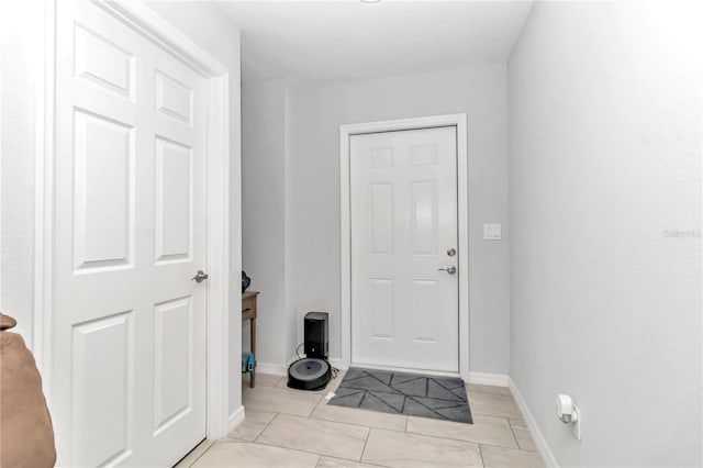 foyer with light tile patterned flooring