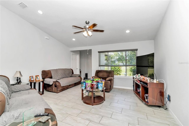 tiled living room featuring ceiling fan