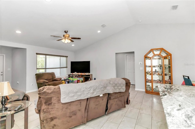 tiled living room with vaulted ceiling and ceiling fan