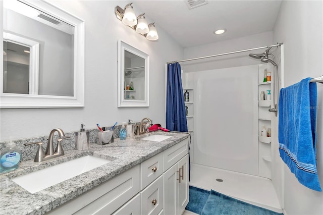 bathroom with vanity and walk in shower