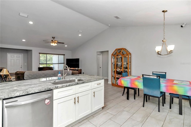 kitchen with ceiling fan with notable chandelier, dishwasher, light tile patterned floors, sink, and lofted ceiling