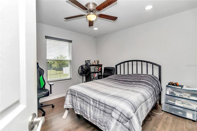 bedroom featuring ceiling fan and hardwood / wood-style flooring