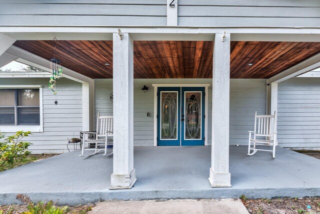 property entrance featuring covered porch