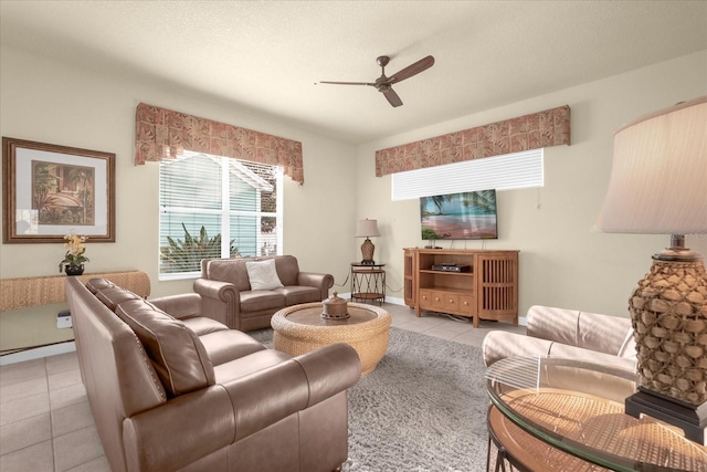 living room with ceiling fan and light tile patterned flooring