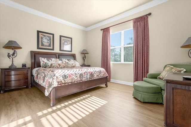 bedroom featuring ornamental molding and light wood-type flooring