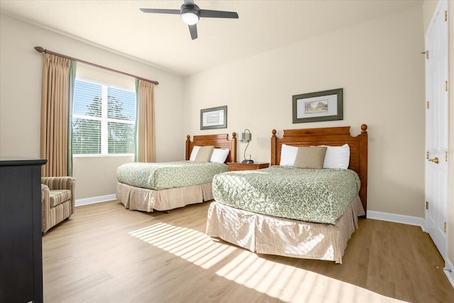 bedroom featuring ceiling fan and light hardwood / wood-style flooring