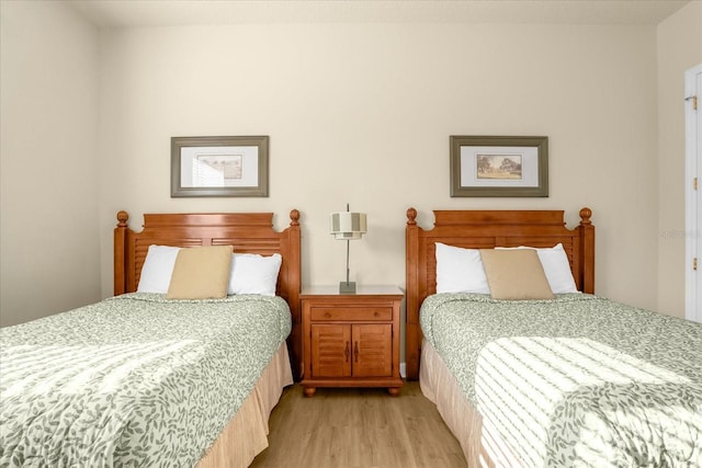 bedroom with light wood-type flooring