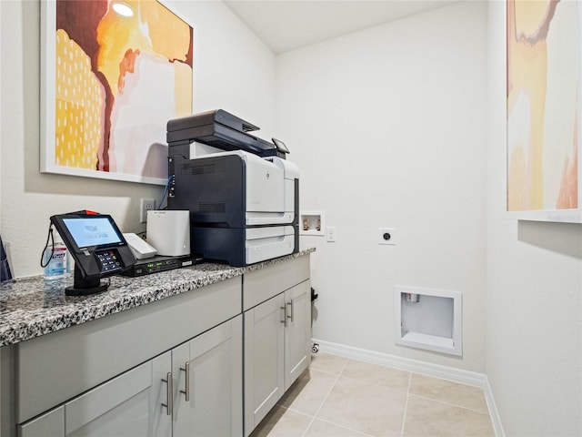 clothes washing area featuring laundry area, light tile patterned floors, baseboards, hookup for an electric dryer, and washer hookup