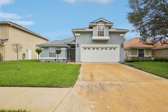 view of front of property with a garage and a front lawn