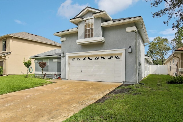 view of front facade with a front lawn and a garage