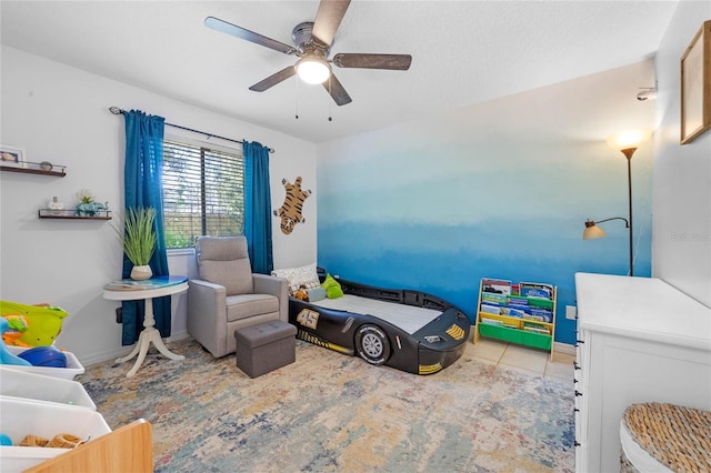 bedroom with baseboards, a ceiling fan, and tile patterned floors