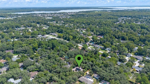 bird's eye view featuring a water view and a wooded view