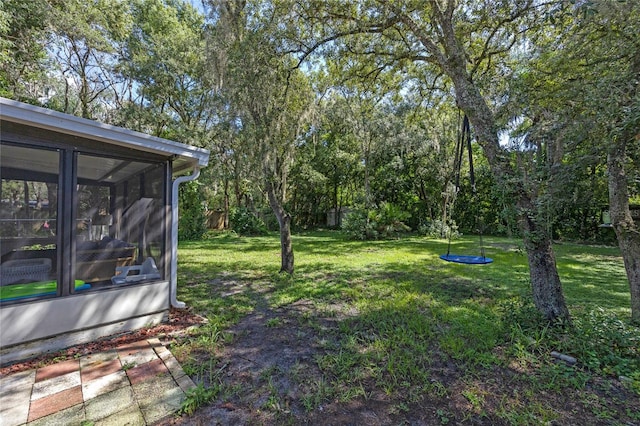 view of yard featuring a sunroom