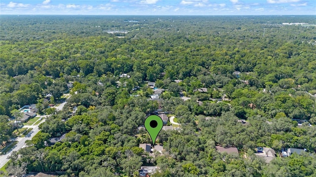 bird's eye view featuring a forest view