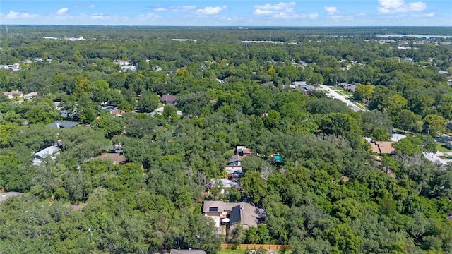 drone / aerial view featuring a forest view