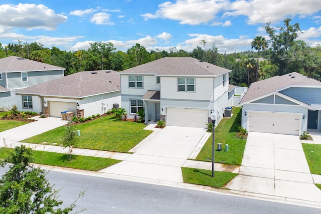 front of property with a front yard and a garage