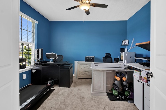 home office with ceiling fan and light colored carpet