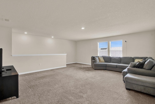 carpeted living room with a textured ceiling