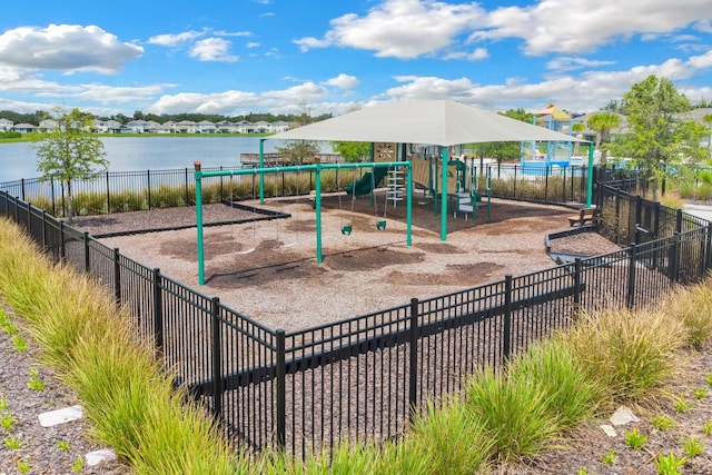 view of playground with a water view