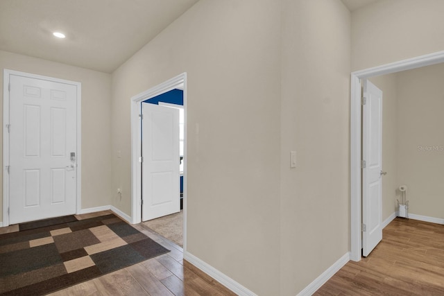 hallway featuring wood-type flooring