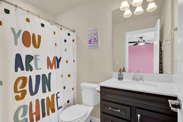 bathroom featuring a shower with curtain, vanity, toilet, and ceiling fan