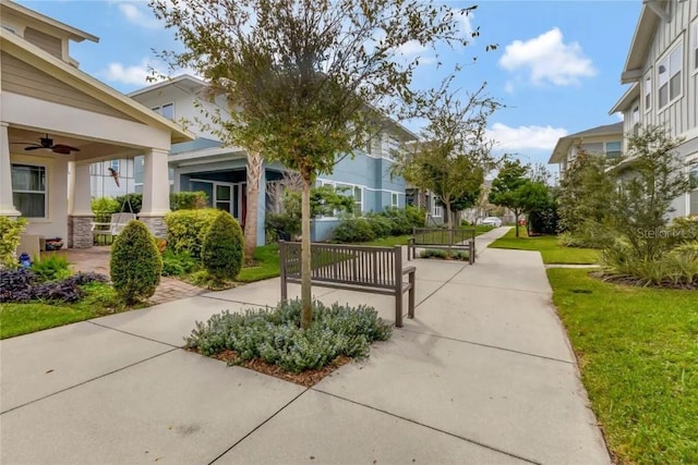 view of home's community featuring a lawn