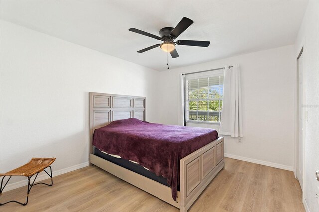 bedroom featuring light wood-type flooring and ceiling fan