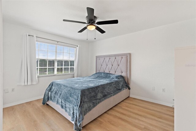 bedroom featuring ceiling fan and light hardwood / wood-style floors