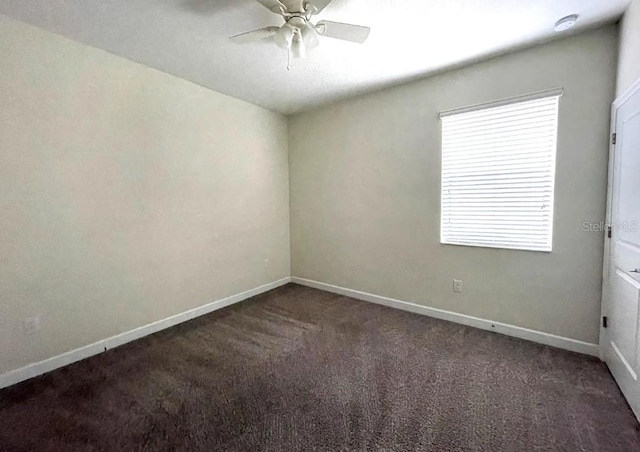 carpeted empty room featuring ceiling fan