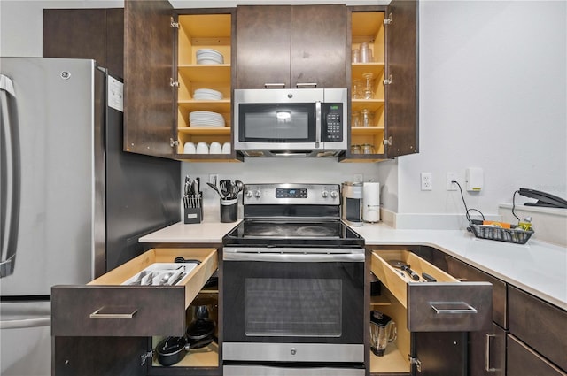 14501 Grove Resort Ave Unit 3329, Winter Garden, FL 34787 - kitchen with open shelves, dark brown cabinets, light countertops, and stainless steel appliances