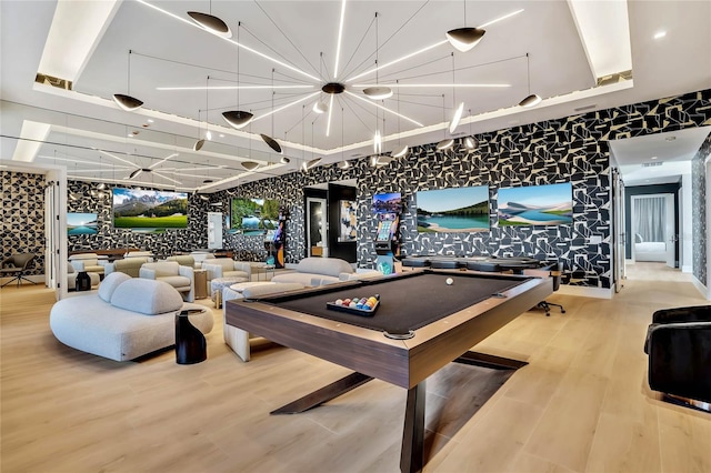 game room with wood-type flooring and billiards