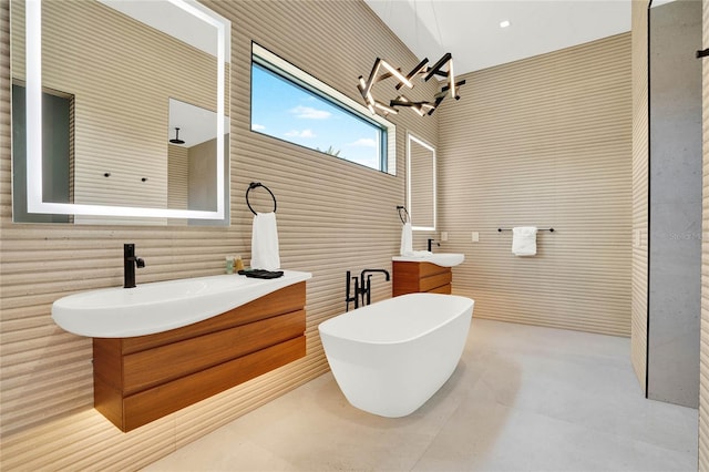 bathroom with vanity and a chandelier