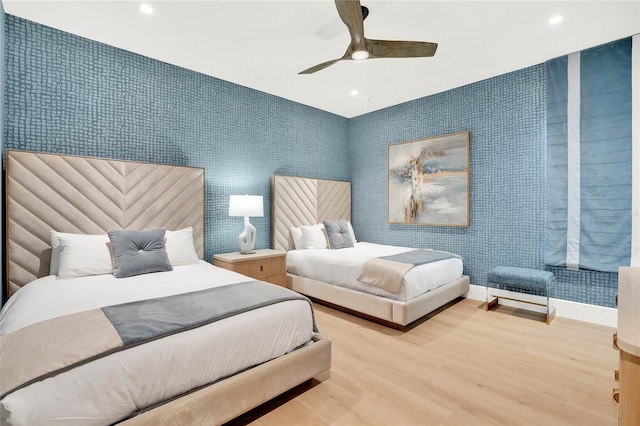 bedroom with hardwood / wood-style flooring and ceiling fan