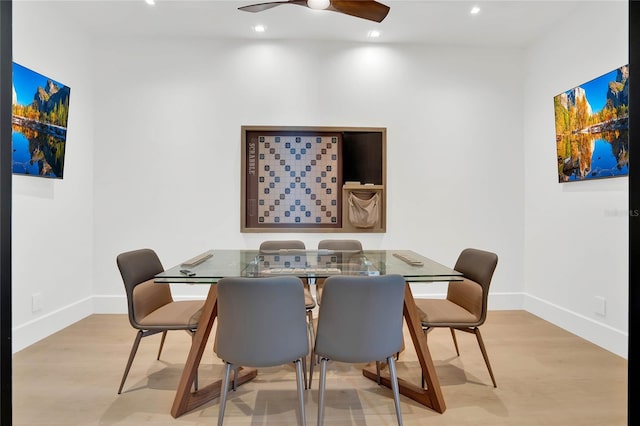 dining room featuring light wood-type flooring and ceiling fan