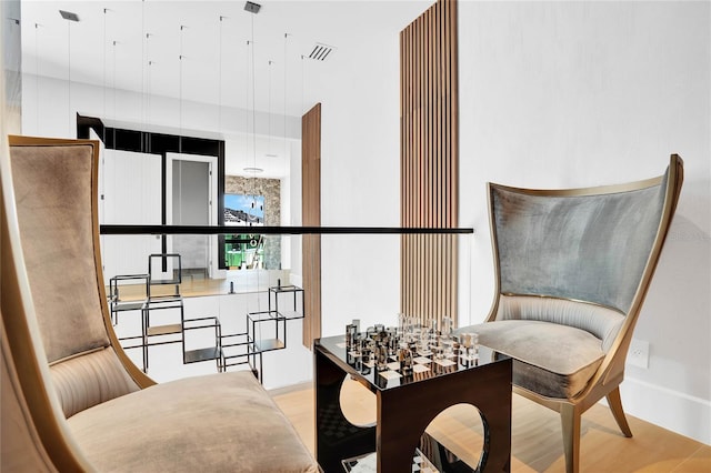 living area with light hardwood / wood-style floors