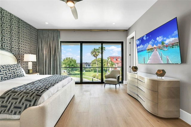 bedroom featuring ceiling fan, light wood-type flooring, and access to outside