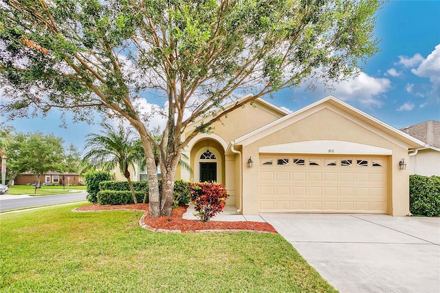 view of front of property featuring a garage and a front yard