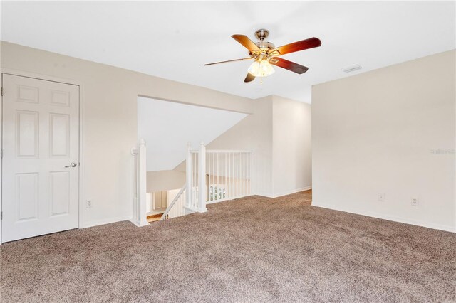 spare room with carpet and ceiling fan